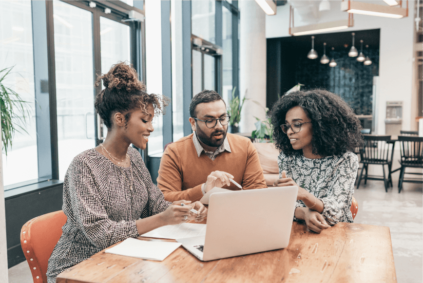 A group of people discussing and working